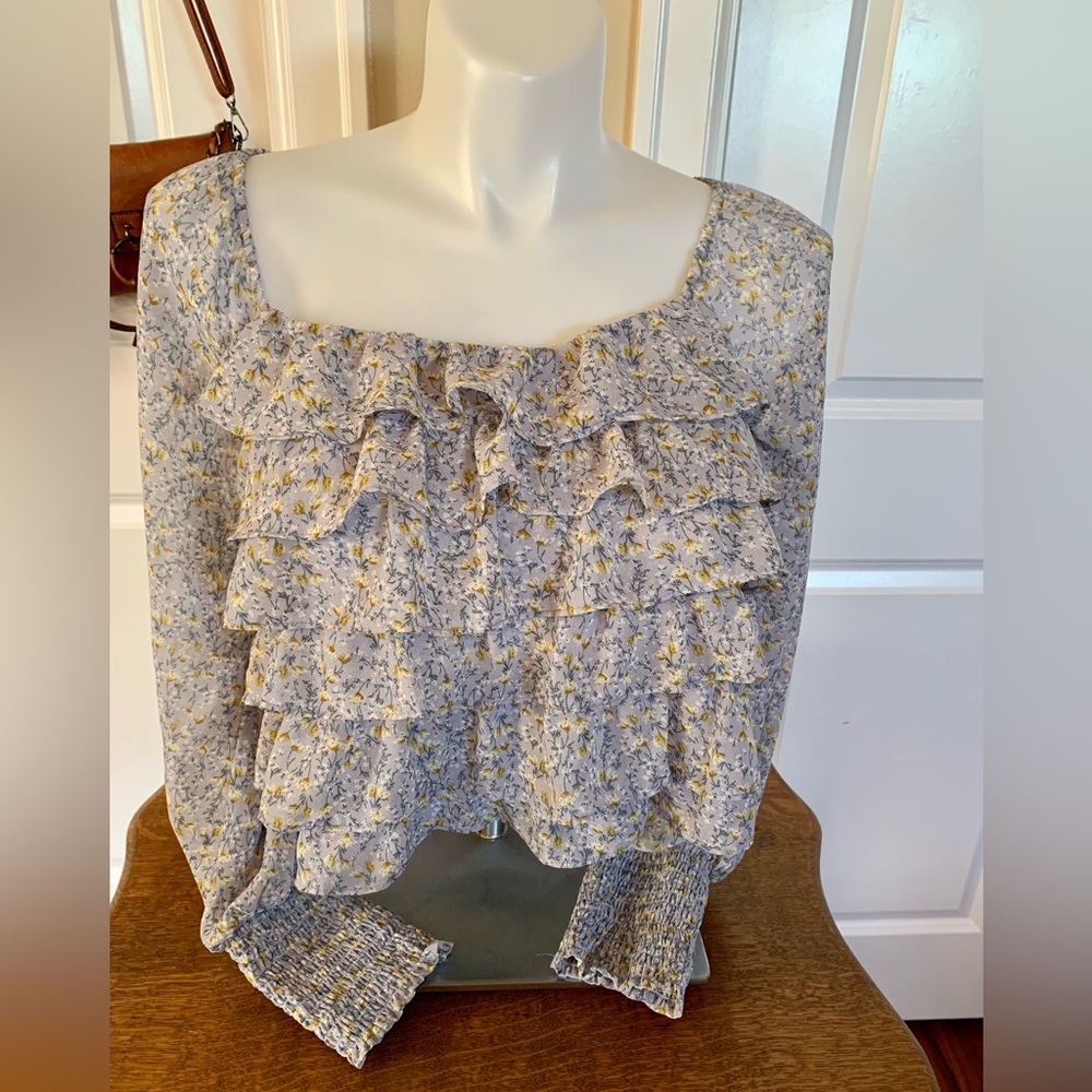 LN ASTR BLUE DITSY BLOUSE. FULLY LINED, RUFFLED FRONT, LONG SLEEVE-SMOCKED CUFF